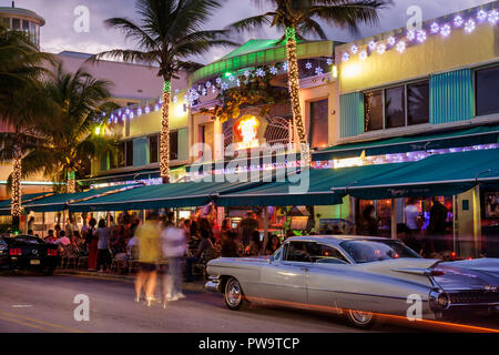 Miami Beach Florida,Ocean Drive,Mango's Tropical Cafe,restaurant restaurants food dining cafe cafes,bar lounge pub,street,sidewalk care,tables,night e Stock Photo