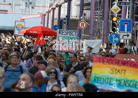 Frankfurt, Germany. 13th Oct, 2018. Protesters march with posters through Frankfurt. Over 3,500 people marched through Frankfurt, to protest against racism and for tolerance. They where accompanied by many local bands, performing on the way and at the rallies. The protest was part of several other protests against racism in Germany on the same day. Credit: Michael Debets/Pacific Press/Alamy Live News Stock Photo