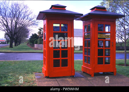 Two old red telephone boxes in the town of Ross in Tasmania, Australia. Ross is an historical town in the Midlands area. Stock Photo