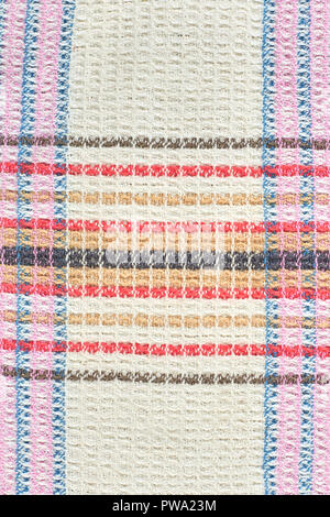 Natural cotton waffle cloth texture. Patterned kitchen towel background. Linen texture fabrics, waffle structure. Stock Photo
