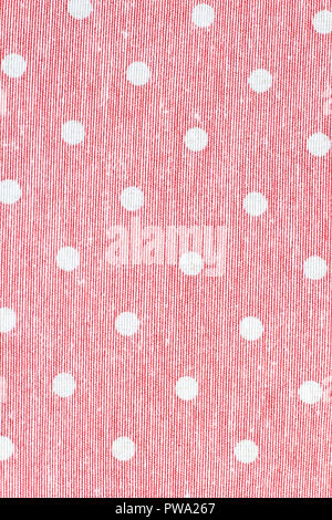 Pink cloth with polka dots. Dotted fabric texture. Natural color cloth background. Stock Photo