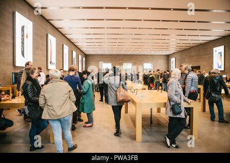Presentation of the iPhone 8 and iPhone 8 plus and sales of new Apple products in the official Apple store in Berlin. Buyers are watching the new iPhone. The long-awaited event. Stock Photo