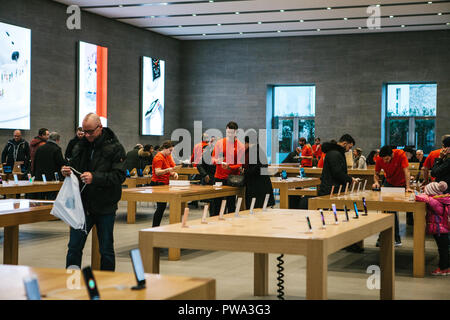 Presentation of the iPhone X and iPhone 8 plus and sales of new Apple products in the official Apple store in Berlin. Buyers are watching the new iPhone. The long-awaited event. Stock Photo
