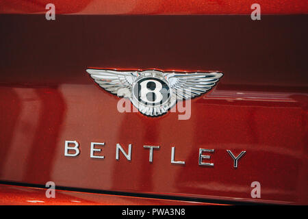 Berlin, August 29, 2018: Close up of a Bentley emblem on the back of a red car. Stock Photo