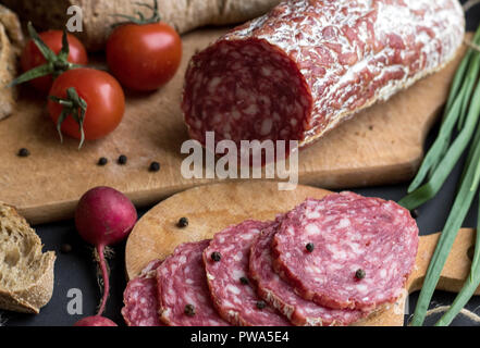 Close up sausage pieces with bread and potatoes Stock Photo