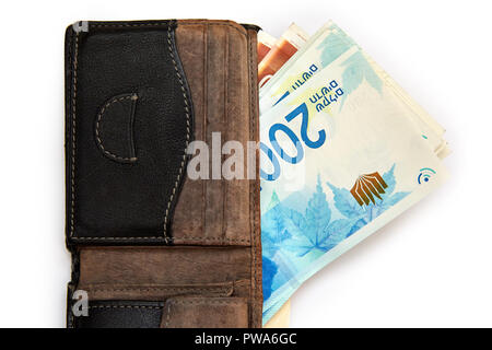 Israeli money stack of the new Israeli 200 Shekels in money bills banknotes isolated on white. Stock Photo