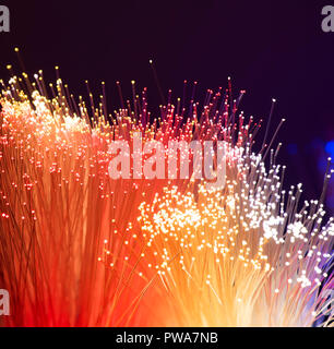 optical fibres dinamic flying from deep on technology background Stock Photo