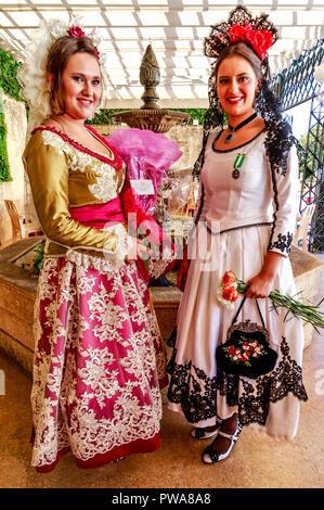 Ronda, Costa del Sol, Andalusia, Spain - Two beautiful young women in traditional Andalusian costume posing for photos on World Tourism Day 27.09.2018 Stock Photo