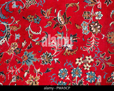 Red persian rug close up with floral design Stock Photo