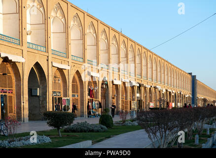 Isfahan, Iran - March 4, 2017 : Souvenir shops in Naqsh-e Jahan Square at sunset. Also known as Meidan Emam, it is now a popular tourist attraction