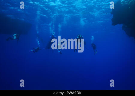 Divers view through a cave Stock Photo