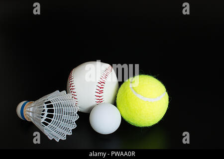 shuttlecock ping pong ball baseball tennis ball on black background Stock Photo