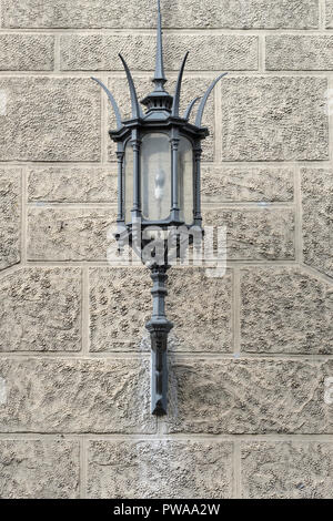 Decorative wrought iron street lamp on house wall, old town of Pistoia, Tuscany, Italy, Europe, Stock Photo