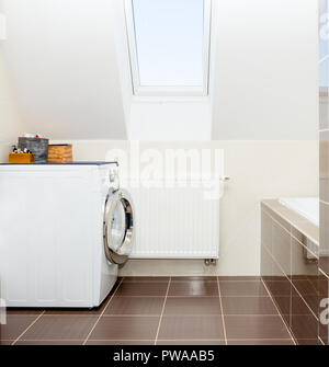 washing machine in bathroom Stock Photo