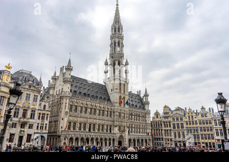 The palace of Brussels illuminated at day in market square at Brussels, Belgium, Europe on a cloudy day with gray sky Stock Photo