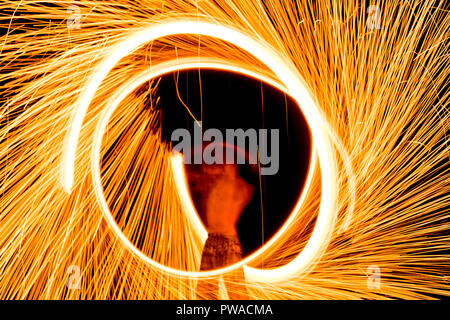 fire dance on beach near the sea , the east coast of thailand Stock Photo