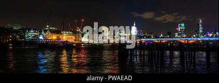 St. Paul's Cathedral and Blackfriars Bridge and station illuminated on the skyline at night, London, UK Stock Photo