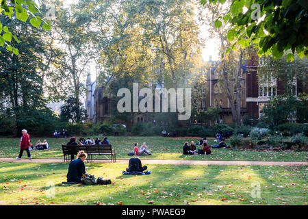 Students in Gordon Square, London, UK, Euston Church in the background Stock Photo