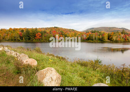 A view of the brilliant and eclectic colors that take over the entire Adirondacks region in New York state of USA during the peak fall season