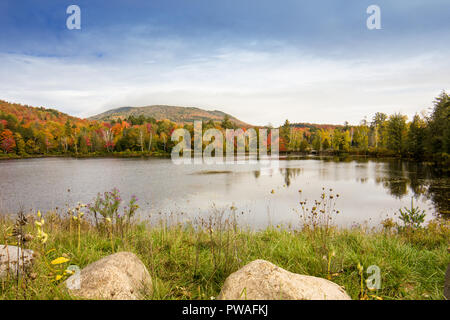 A view of the brilliant and eclectic colors that take over the entire Adirondacks region in New York state of USA during the peak fall season