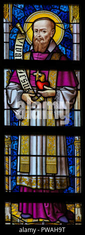 Stained Glass window depicting Francis Xavier in the Cathedral of Saint Bavo in Ghent, Flanders, Belgium. Stock Photo