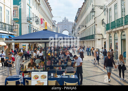 LISBON, PORTUGAL - OCTOBER 10, 2018: People on Augusta street in the day. Augusta Street with the Triumphal Arch - is the famous tourist attraction in Stock Photo