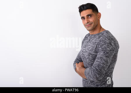 Young muscular Persian man against white background Stock Photo
