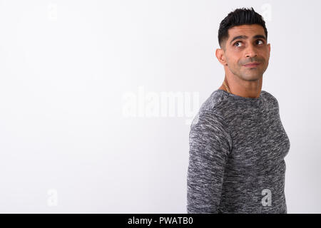 Young muscular Persian man against white background Stock Photo