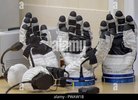 Sokol suit gloves for Expedition 57 Flight Engineer Nick Hague of NASA and Flight Engineer Alexey Ovchinin of Roscosmos are ready to be donned during the suit pressure checks, at the Baikonur Cosmodrome October 11, 2018 in Baikonur, Kazakhstan. Shortly after lift off the rocket malfunctioned en route to the International Space Station and aborted forcing an emergency landing in Kazakhstan. The crew members have been picked up by search and rescue and are reportedly in good condition. Stock Photo