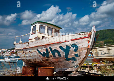 Old, abandoned fishing boat ('kaiki') at the shipyards of Agios Georgios, Skiathos town, Skiathos island, Northern Sporades, Greece. Stock Photo