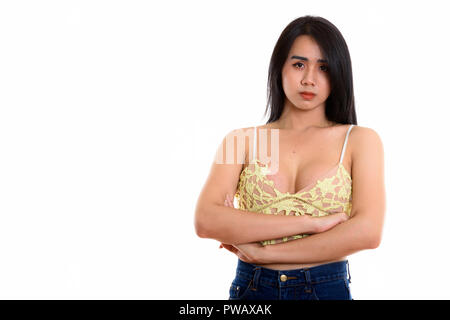 Studio shot of young Asian transgender woman with arms crossed Stock Photo