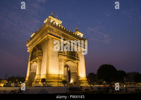 Lit Patuxai (Patuxay), Victory Gate or Gate of Triumph, war monument in Vientiane, Laos, at dusk. Stock Photo