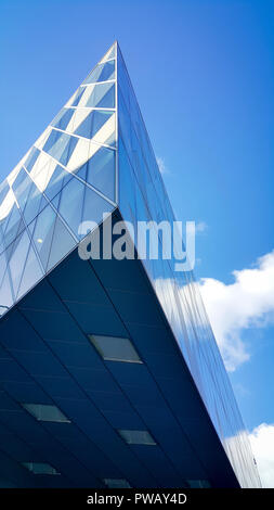 Glazed architectural block cantilevered above entrance, Emporio Armani store, Deansgate, Spinningfields, Manchester Stock Photo