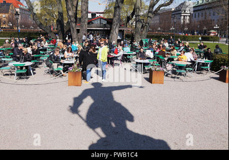 Stockholm, Sweden - April 19, 2014: Shadow of the statue of the king Swedish king Charles XII pointing east in  the Kungstradgarden park. Stock Photo
