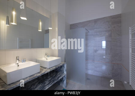 Spacious modern bathroom with double basin and a large mirror Stock Photo