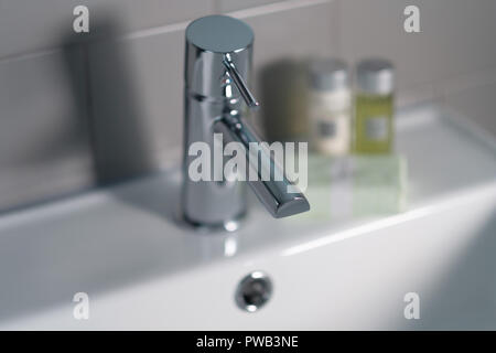 Selective focus photo of a water tap in the restroom Stock Photo