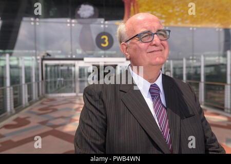 Overweight senior businessman lounging around the airport of Ban Stock Photo