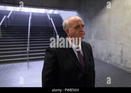 Overweight senior businessman lounging around the airport of Ban Stock Photo