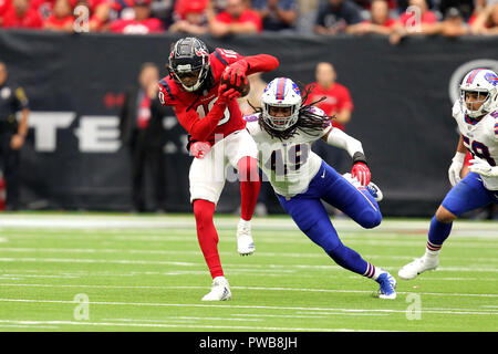 Houston, Texas, USA. 14th Oct, 2018. Houston Texans wide receiver DeAndre Hopkins (10) is tackled from behind by Buffalo Bills linebacker Tremaine Edmunds (49) after a pass reception during the fourth quarter of the NFL regular season game between the Houston Texans and the Buffalo Bills at NRG Stadium in Houston, TX on October 14, 2018. Houston won, 20-13. Credit: Erik Williams/ZUMA Wire/Alamy Live News Stock Photo