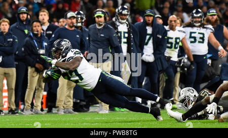 Seattle Seahawks running back (27) Mike Davis heads for the field