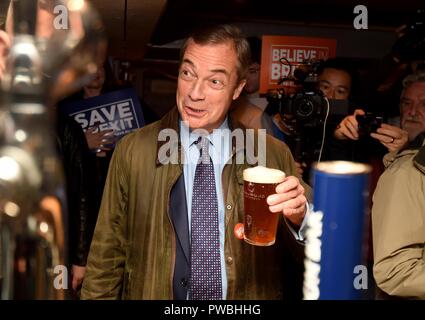 Bournemouth, UK. 15th Oct 2018. Nigel Farage MEP visits Bournemouth's Christchurch Market during the Leave Means Leave Brexit tour, UK. Pictured visiting The Ship pub for a pint Credit: Finnbarr Webster/Alamy Live News Stock Photo