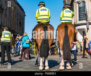 Rear view of police horses at Scottish Independence All Under One Banner AUOB march 2018, Royal Mile, Edinburgh, Scotland, UK Stock Photo