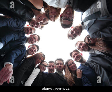 large business team is forming a circle and looking at the camera Stock ...