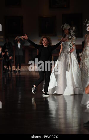 NEW YORK, NY - APRIL 12: Reem Acra greets the audience after presenting her Reem Acra Spring 2019 Bridal Collection at the New York Public Library on  Stock Photo