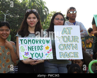 Manila, Philippines. 14th Oct, 2018. Students with different placards of quotable quotes at the Solidarity March in Manila. The Philippines holds the first-ever Solidarity Walk for Mental Health in Manila City on October 14. The march is organized in partnership with the Office of Senator Risa Hontiveros, and will also be held in commemoration of International Mental Health Month in October. Credit: Josefiel Rivera/Pacific Press/Alamy Live News Stock Photo