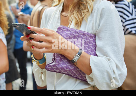 MILAN - JUNE 16: Man with green Goyard bag Jaeger Le coultre Reverso watch  before Marni fashion show, Milan Fashion Week street style on June 16, 2018  Stock Photo - Alamy