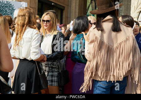 MILAN, ITALY - SEPTEMBER 20, 2018: People waiting before Genny fashion show, Milan Fashion Week street style Stock Photo