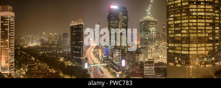View of Jakarta downtown with skyscrapers lit. Jakarta, Indonesia Stock Photo