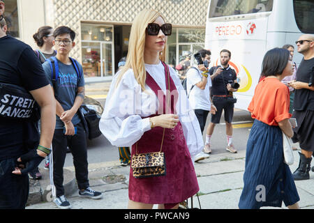 MILAN, ITALY - SEPTEMBER 20, 2019: Woman with white leather Yves