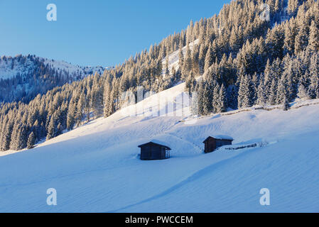 Small hut in Alps mountains in winter scenery. Stock Photo